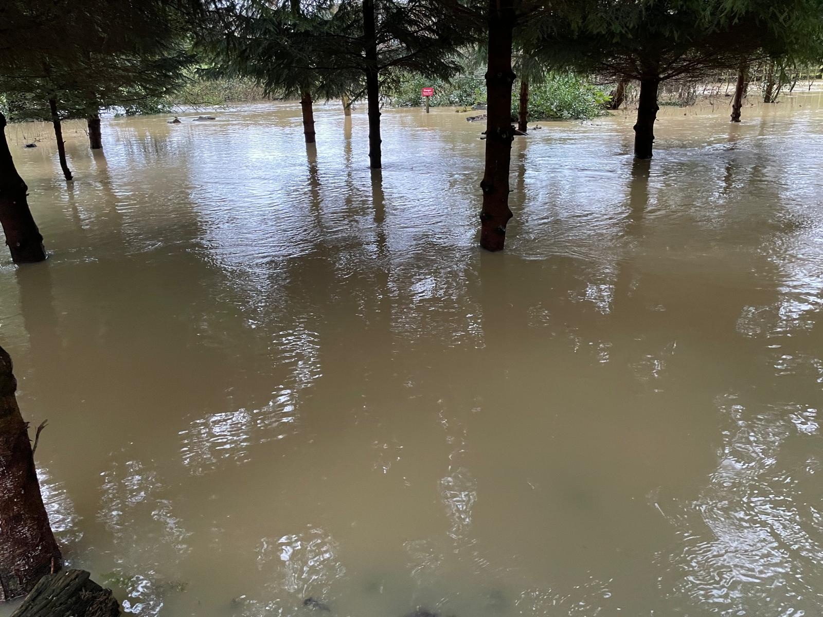 Floodwater across the churchyard at Church End in January 2024